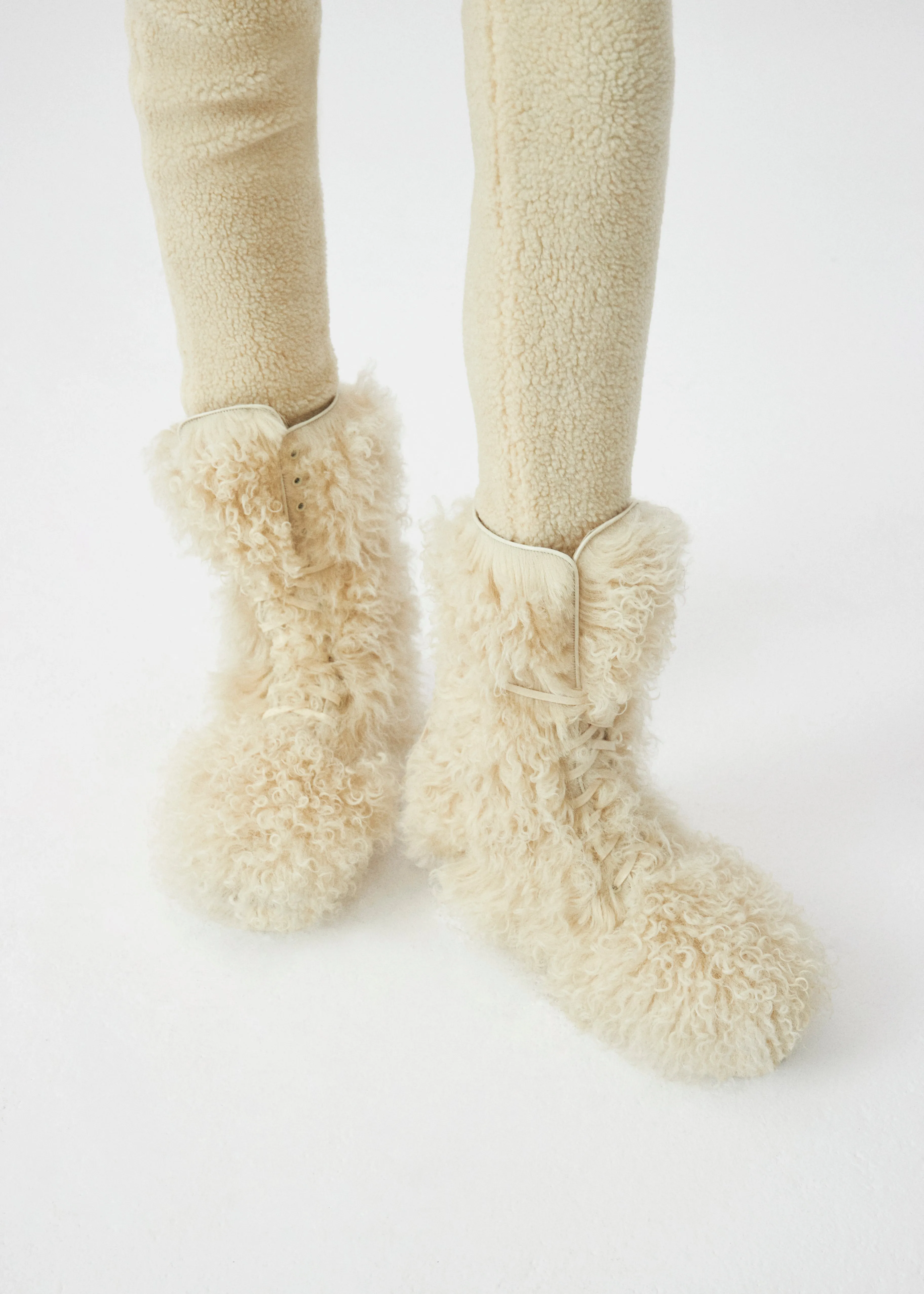 Shearling combat boots in cream